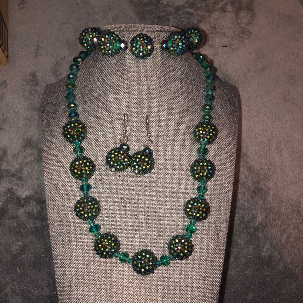 Necklace bracelet and earrings set.  Green glass crystals. With ab facets.